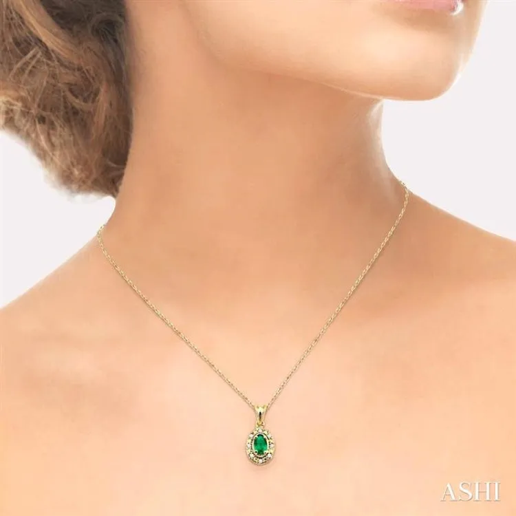 5x3mm Oval Shape Emerald and 1/20 Ctw Single Cut Diamond Pendant in 14K Yellow Gold with Chain.